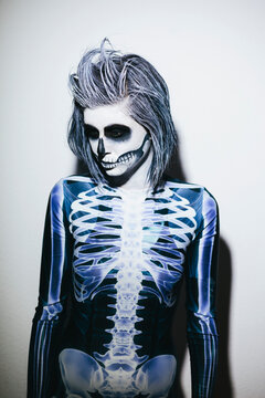 Woman with halloween make up and skeleton costume