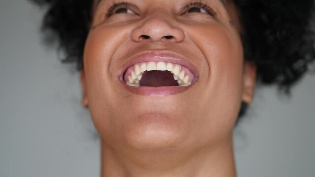 Young Brazilian woman authentic smile and laugh portrait face