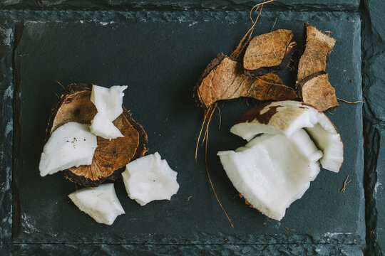 smashed coconut on black shale tile