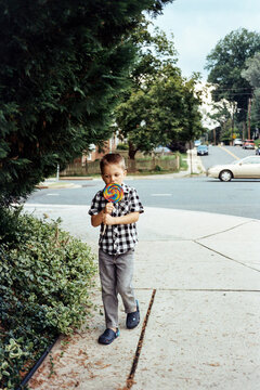 Young boy enjoying a lollipop