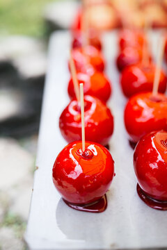 Just coated candy apples in a row for Halloween