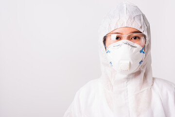 Portrait and closeup Asian female woman doctor or nurse in PPE uniform and gloves wearing face mask protective in laboratory holding, Health medical coronavirus or COVID-19 concept
