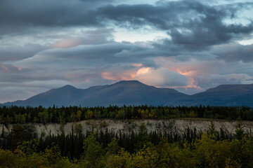 Beautiful View of Canadian Mountain Landscape during a colorful cloudy sunset. Located near Whitehorse, Yukon, Canada. Nature Background