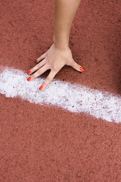 Female hand at start line