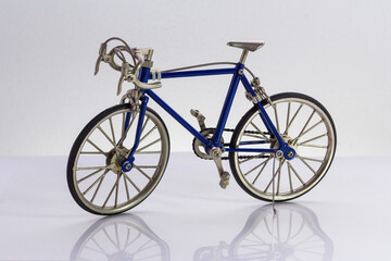 Fototapeta na wymiar blue toy road bike isolated on white background