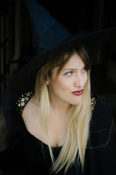 Portrait of a blonde female model costume as witch