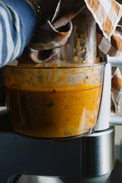 Closeup of a blender blitzing a soup.