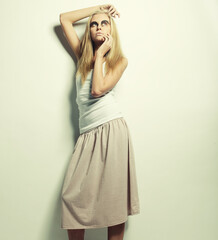 Fototapeta premium fashion model posing on light background