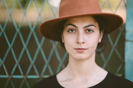 portrait of real young woman with hat
