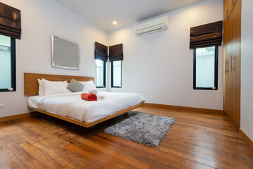Interior design of house, home and villa feature bed, duvet, rug, pillow, and window in bedroom