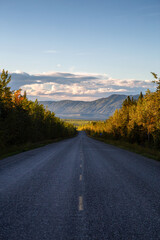 Scenic Road View of Klondike Hwy during a sunny and colorful sunset. Taken North of Whitehorse, Yukon, Canada.