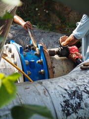 Bolt and nuts installation work on main pipe connections