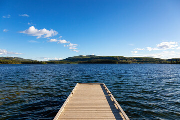 Wooden Quay at Twin Lakes Campground during a sunny summer day. North of Whitehorse, Yukon, Canada.
