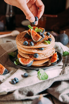 Delicious breakfast. Homemade pancakes with fresh figs and bluberries