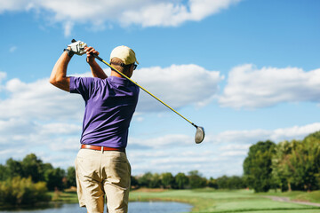 golfer swinging his driver