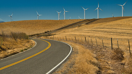 curved round through the country surrounded by windmills