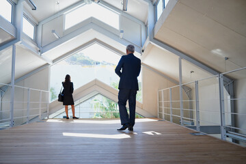 Real estate agent approaching client in trendy space