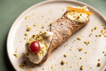 Canolli with a cherry