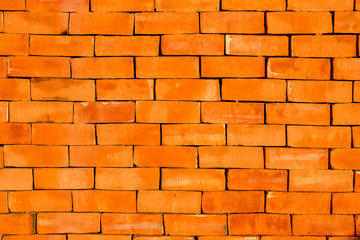 Cambodian handmade orange bricks as background.