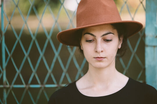 portrait of young woman with hat .