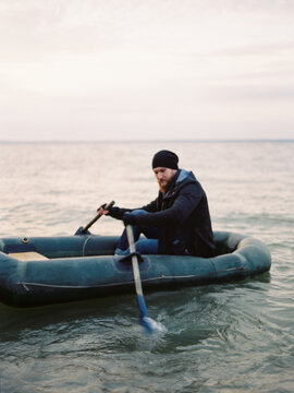 Man in row boat. Film