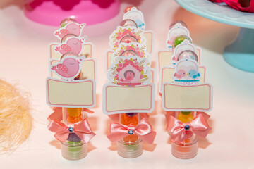 Table with children's birthday party decoration with objects and colorful candies