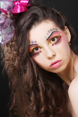 Fototapeta premium Beautiful lady with artistic make-up.