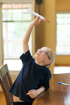 Creative Little Boy Rocket Scientist WIth Home Made Model Rocket Ready for Flight
