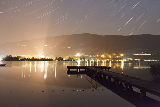 Startrails at a small dock in Mondsee, austria at night