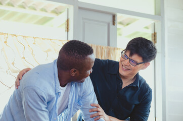 Gay couple homosexual cooking together at kitchen, LGBT concept