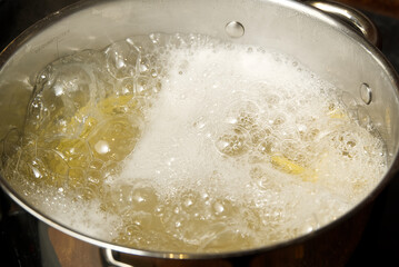 boiling pasta spaghetti in pot. penne rigate pasta- Cooking pasta in boiling water.