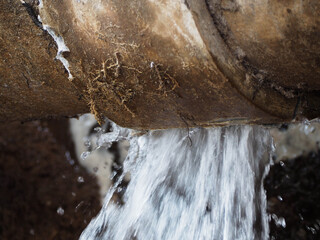 Splashing water from burst pipe