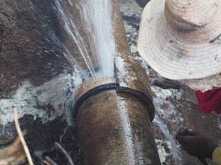 Splashing water from burst pipe