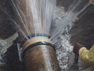 Obraz na płótnie Canvas Splashing water from burst pipe