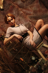Obraz na płótnie Canvas fashion model sitting on a stool