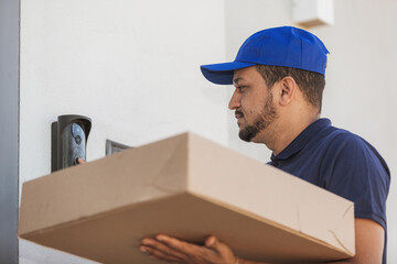 Delivery man ringing house bell