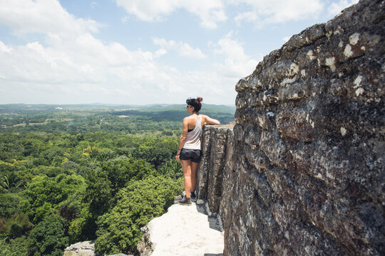 Woman Enjoying View From Atop Ancient Mayan Temple