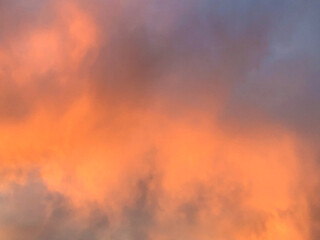 Dramatic sunset or sunrise sky with orange and purple clouds
