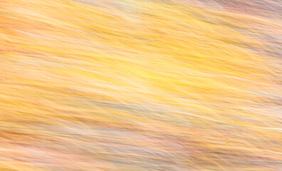 Abstract diagonal texture in shades of yellow and orange