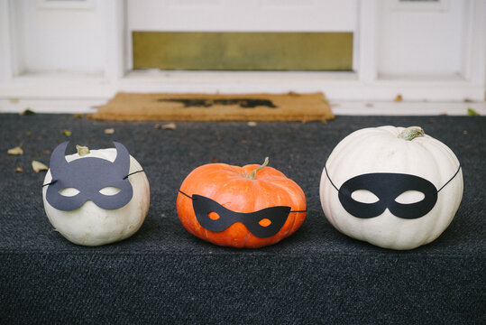 three pumpkins on steps