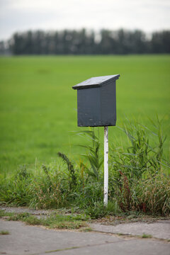 Rural Dutch mailbox at the beginning of a driveway