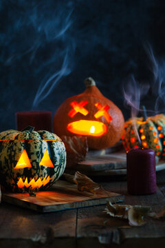 Halloween: Spooky jack-o-lanterns with smoke.