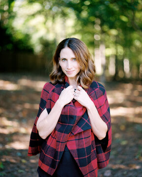 Beautiful and fashionable woman in a poncho