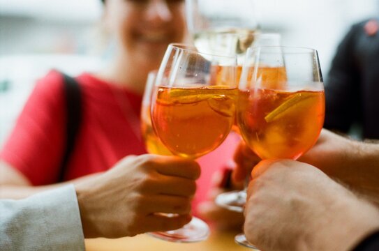 Friends drinking cocktails outdoors