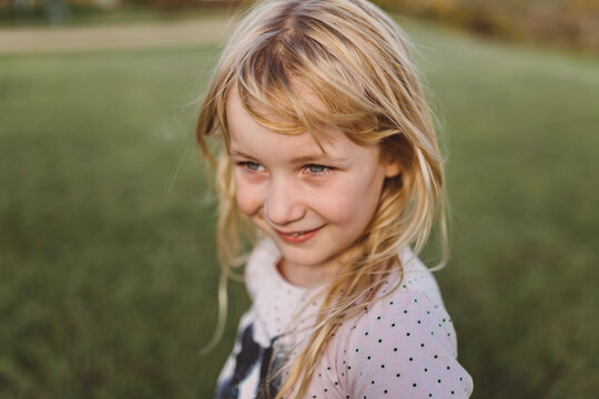 Portrait of smiling young girl looking away