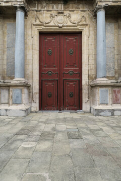Ancient facade with red doors