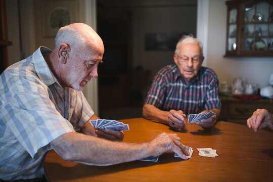 Group of seniors playing games together inside