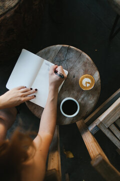 Pretty Girl Journals and Drinks Coffee