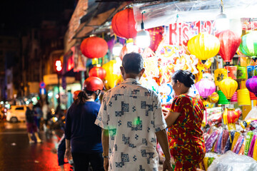 People come to the street of lanterns to shopping and take photos for the mid-autumn festival in Cho Lon, Chinatown, Vietnam