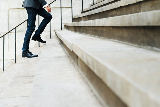 Businessman walking on the stairs